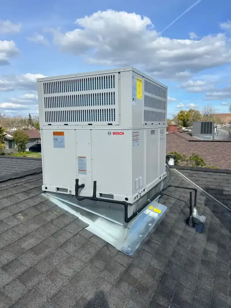 Technicians installing a new central air conditioning system